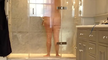 voyeur unaware MILF in the shower