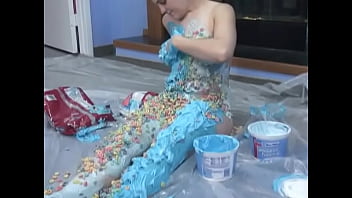 Sexy chick loves to smear herself with sweet dessert in the kitchen on the floor