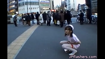 Naughty Asian girl is pissing in public