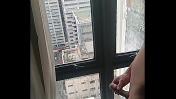 Asian Jerking off in front of Huge Hotel window