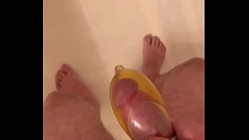 Filling a condom with piss and then cum
