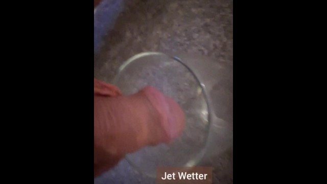 Desperately pissing in secret into a pint glass