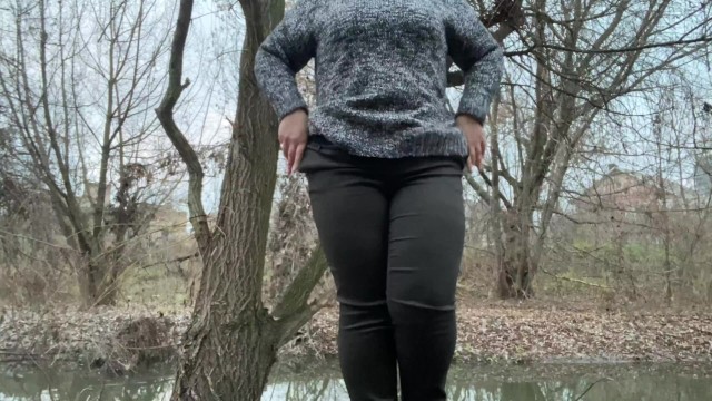 Doggystyle pissing of a woman who wears pantyhose under her pants