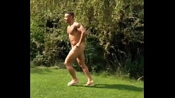 Bodybuilder running outdoors
