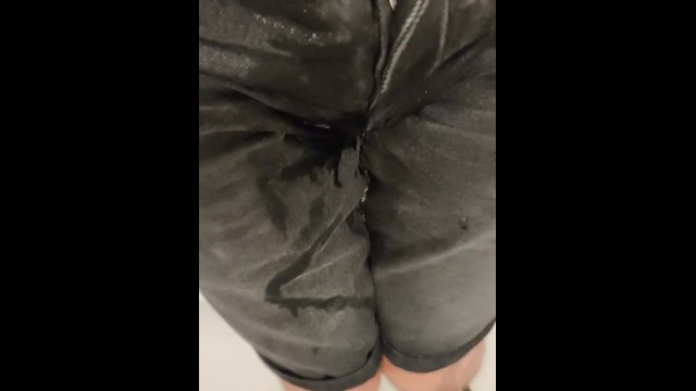 Pissing Black shorts and Sneakers