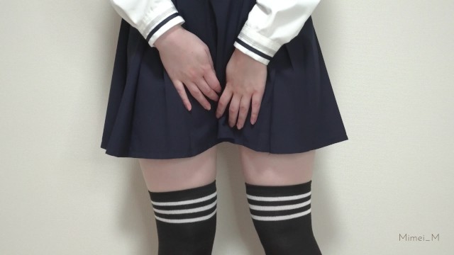 Cute Japanese schoolgirl tries to pee in a plastic bottle
