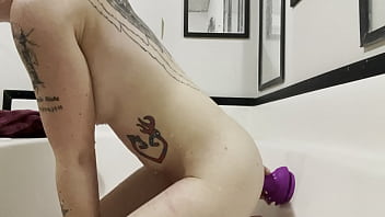 redhead amateur fucking her dildo in the tub
