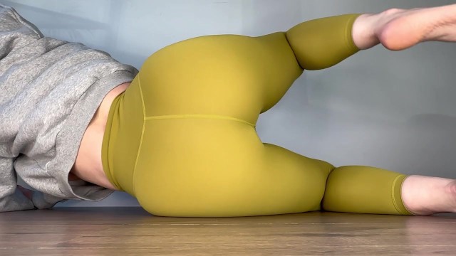 Sexy teen lying down peeing in gym leggings