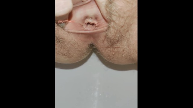 Extremely close up wide open hairy pussy pissing for your pleasure