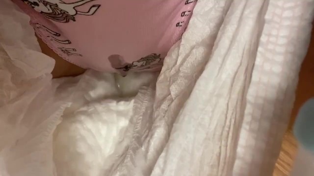 By the Christmas tree pissing in cute panties under a diaper
