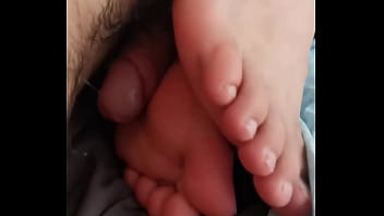 My dick rubs against his meaty feet!