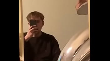 Young guy jerks off in front of mirror