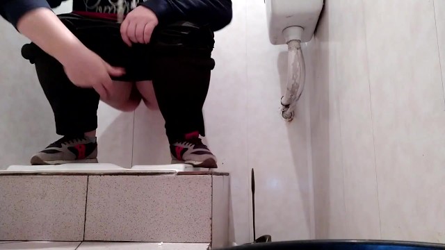 Hot milf pissing in public toilet